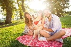happy young family with their dog